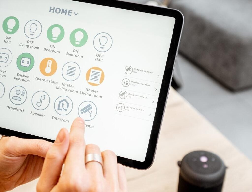 The Best Smart Doorbells and Cameras Reviewed Woman Controlling Smart Devices With A Digital Tab 2023 11 27 04 51 21 Utc 1 E1734668241912 1024x778